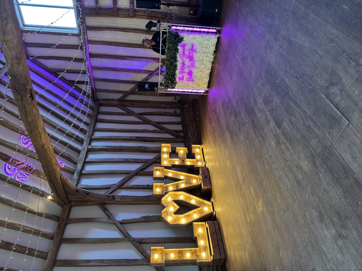 Barn wedding with flower wall
