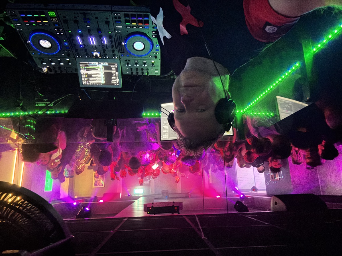 DJ K-Sym with crowd and club lighting